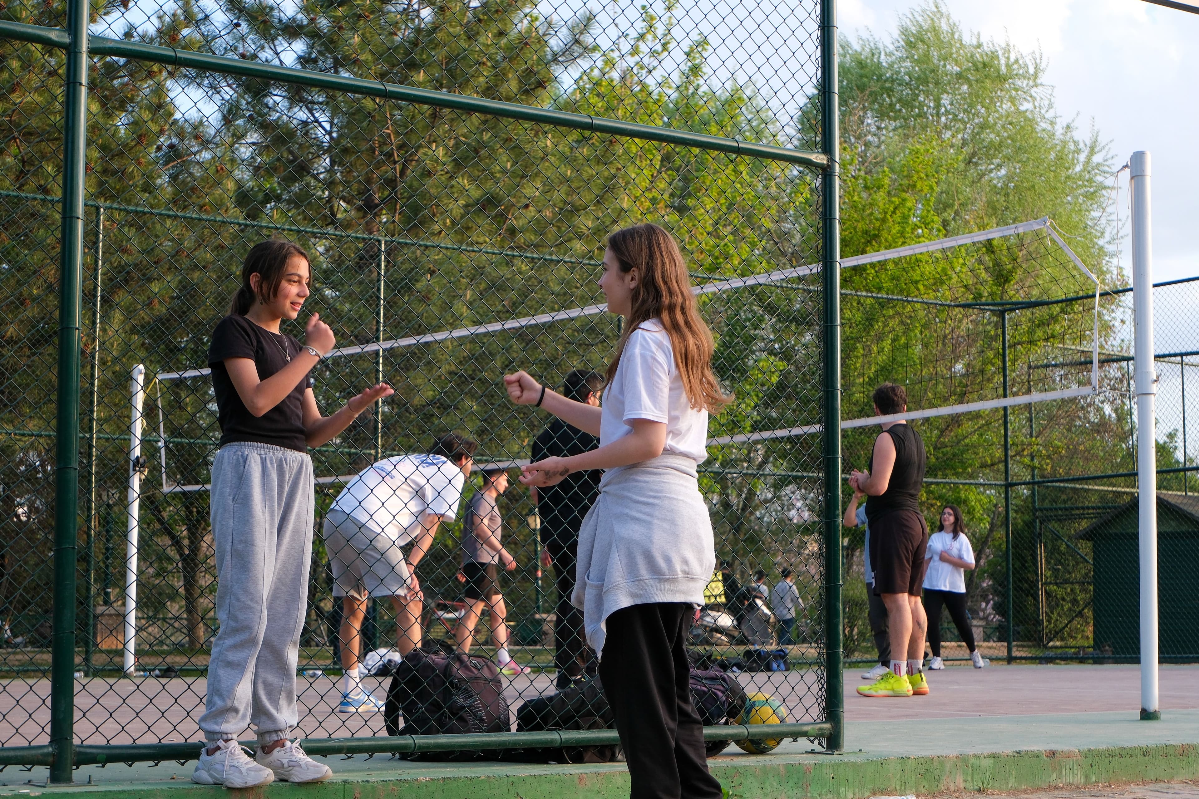 Padel players socialising after a game on Lob